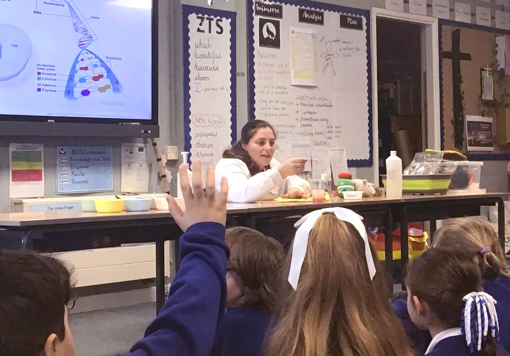 A scientist giving a demonstration at a primary school.
