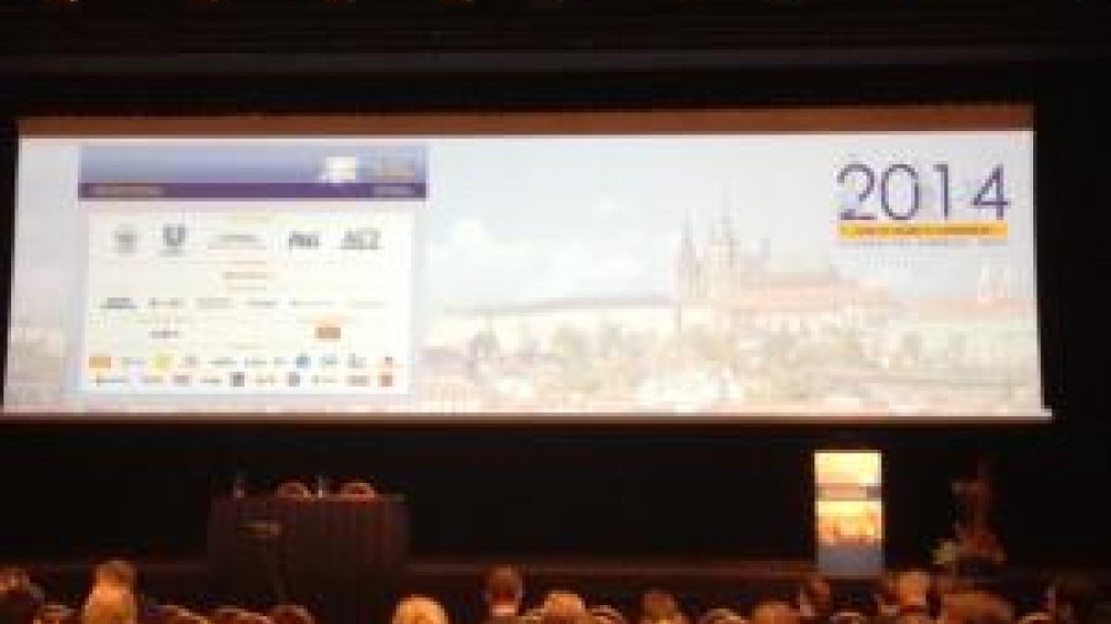 A stage with a poster of the 9th World Congress on Alternatives and Animal Use in the Life Sciences