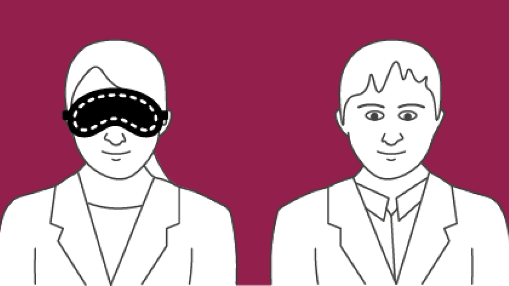 Two persons with one wearing a mask over their eyes