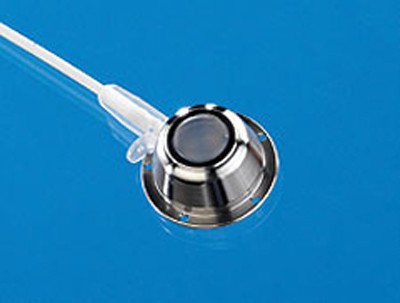 A typical vascular access port with attached vascular catheter, suitable for use in larger laboratory animals.