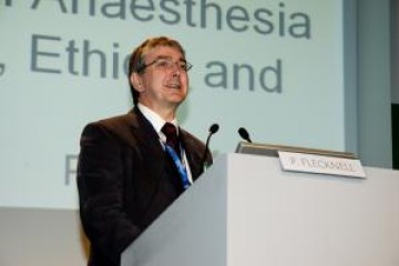 Professor Paul Flecknell giving a speech on a podium
