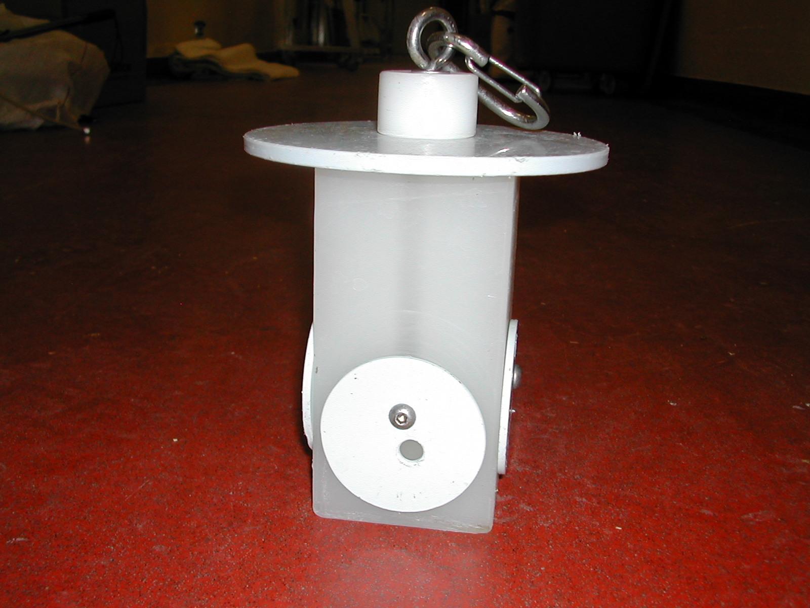 Example of a puzzle feeder made from plastic where monkeys are required to swivel pieces of plastic around to access food